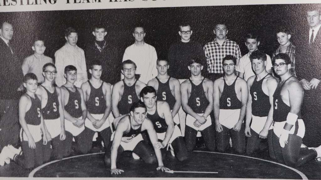 1966 wrestling team poses for picture