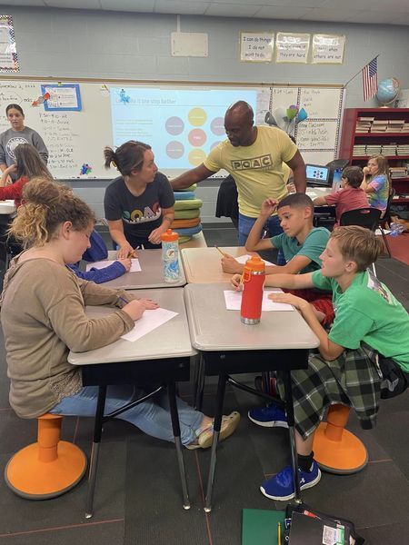 Middle School students mentor elementary students in POAC program