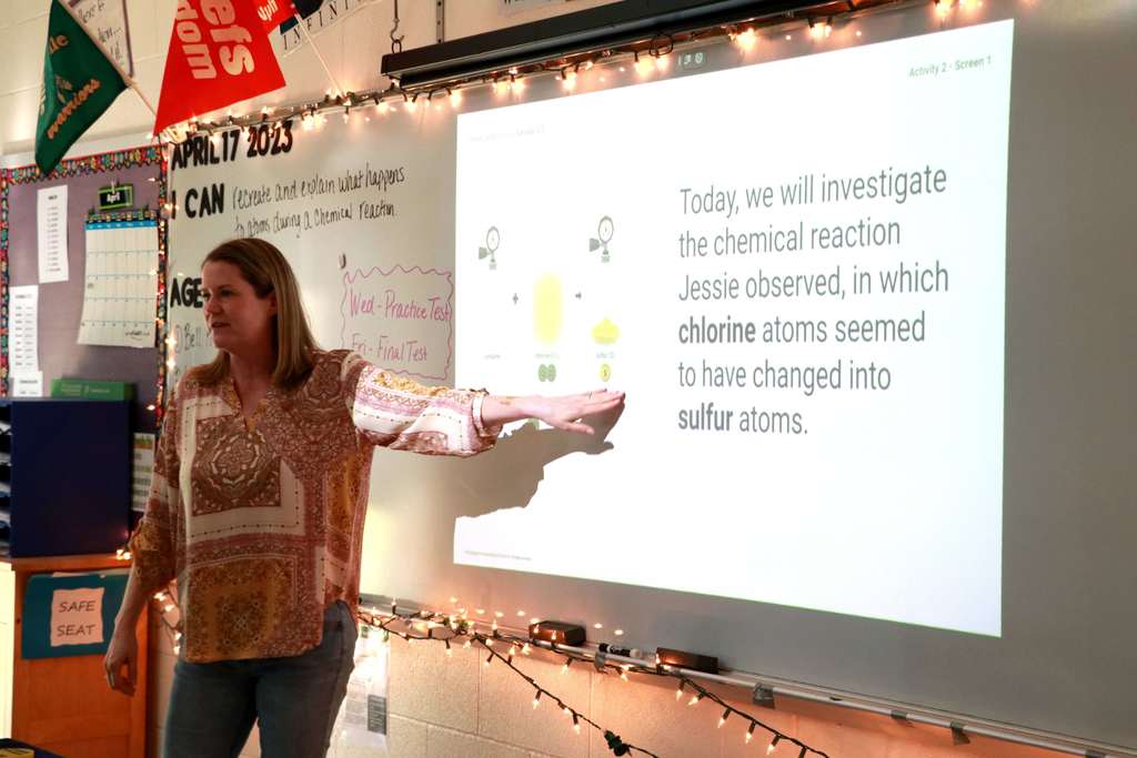 Mrs. Bosley teaches students about atom combinations