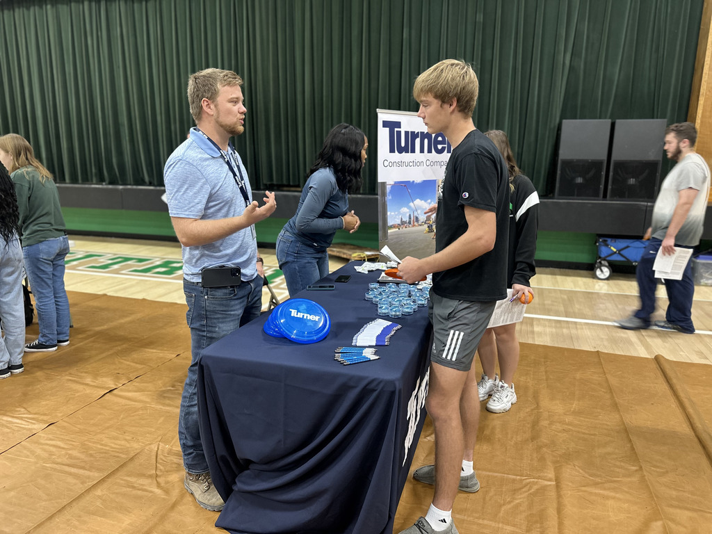 Students speak to career fair representatives