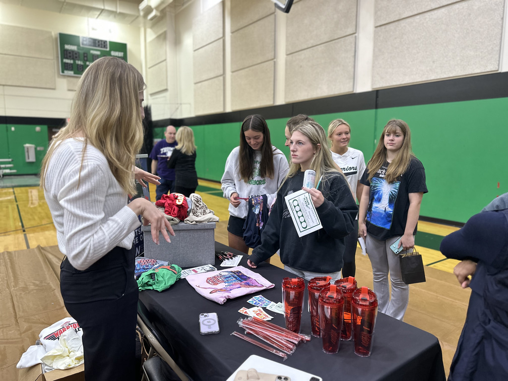 Students speak to career fair representatives