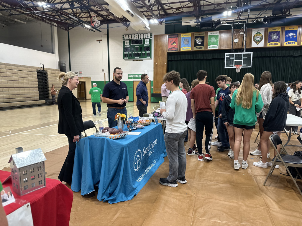 Students speak to career fair representatives
