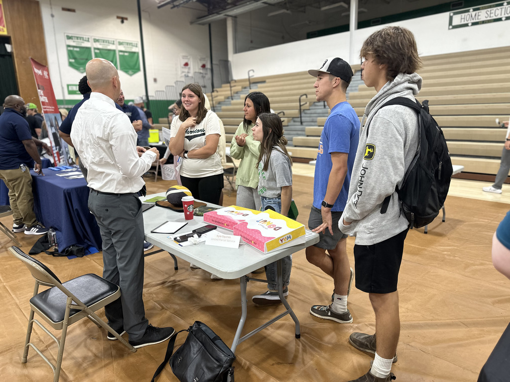 Students speak to career fair representatives
